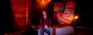 Man sitting on a stage