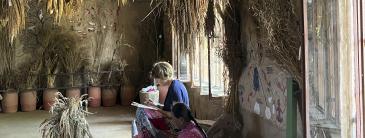 Image of two people drawing