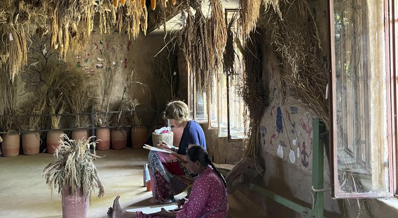 Image of two people drawing