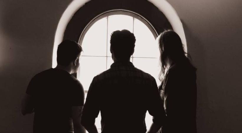 Image of three people