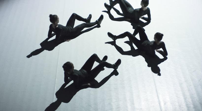 4 dancers on the ground.